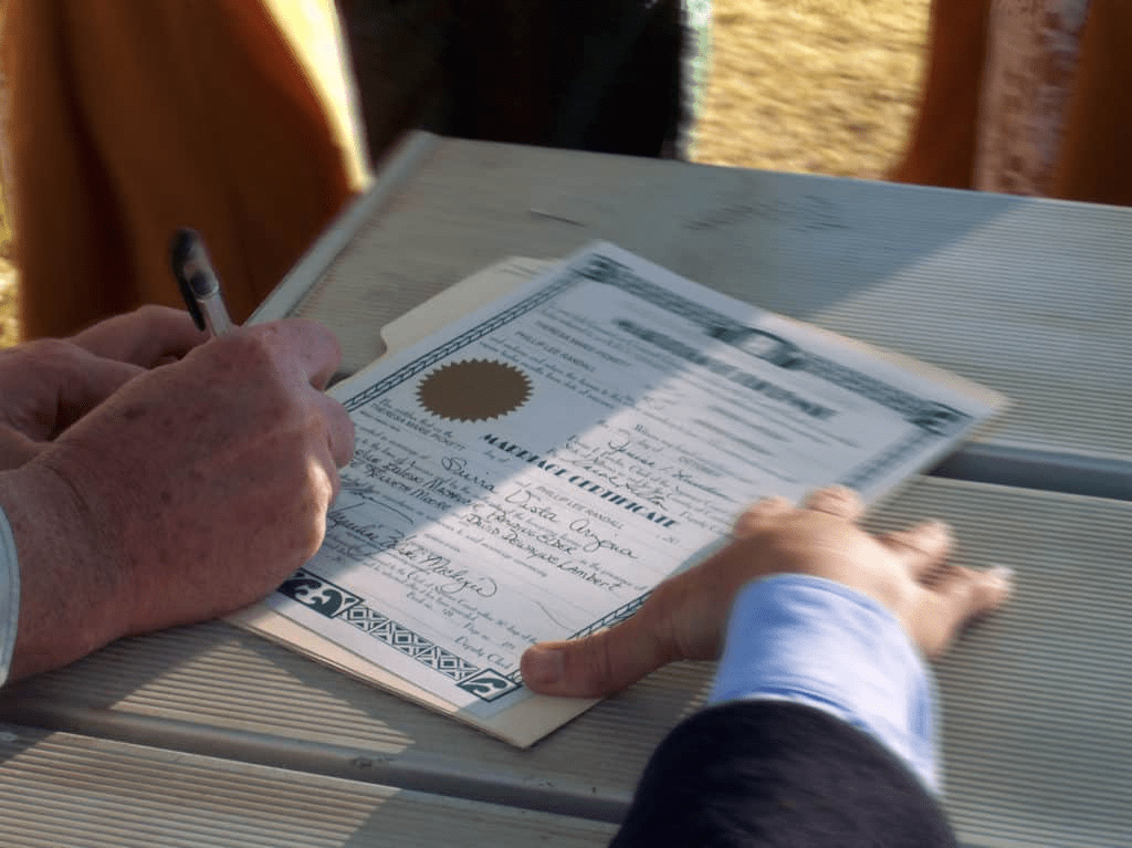 Royalty-free image of a hand signing a contract. But wait... where is the REST of that body? Pretty creepy.